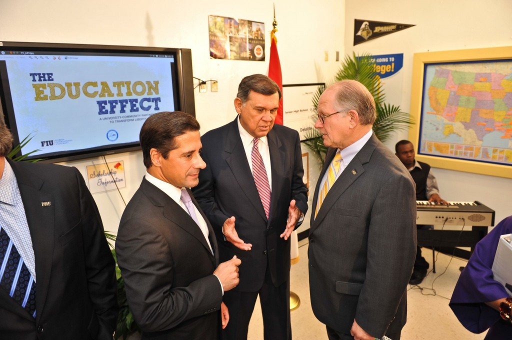 MDCPS Superintendent Alberto Carvalho, JPMorgan Chase Florida Chairman Mel Martinez and FIU President Mark B. Rosenberg discuss The Education Effect at the check presentation in September 2011.