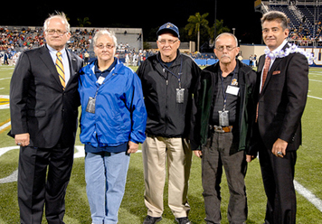 From left to right: FIU President Mark B. Rosenberg, Arlene and Paul Felsberg, John D. Webster, and Executive Director of Sports and Entertainment Pete Garcia at the FIU vs. FAU football game on November 12, 2011. During halftime, the Felsbergs and Webster were recognized for their transformative gifts to the Michael Felsberg Scholarship Endowment in support of FIU Athletics.