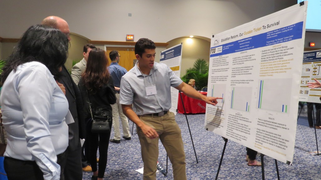 Emilio Baglietto shares details about his research project “Education Reform, Our Golden Ticket To Survival” to onlookers at at the 2016 Conference for Undergraduate Research at FIU. 